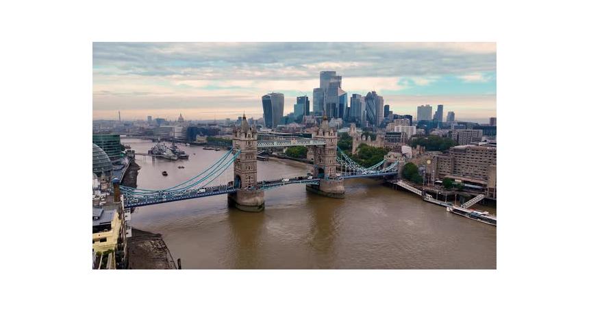 A breathtaking aerial descent unveils London's iconic Tower Bridge, standing proudly over the Thames