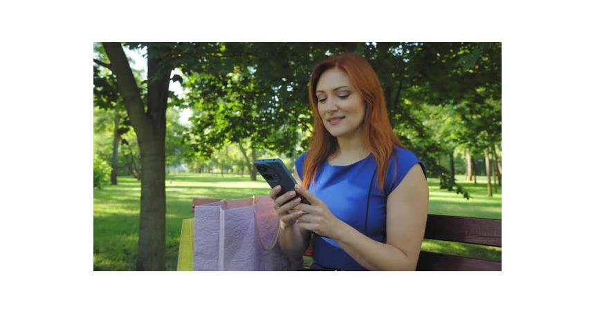 Excited Middle Aged Shopper Woman Celebrating Purchase During Online Shopping